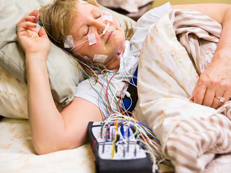 A patient is set up for a home sleep study.